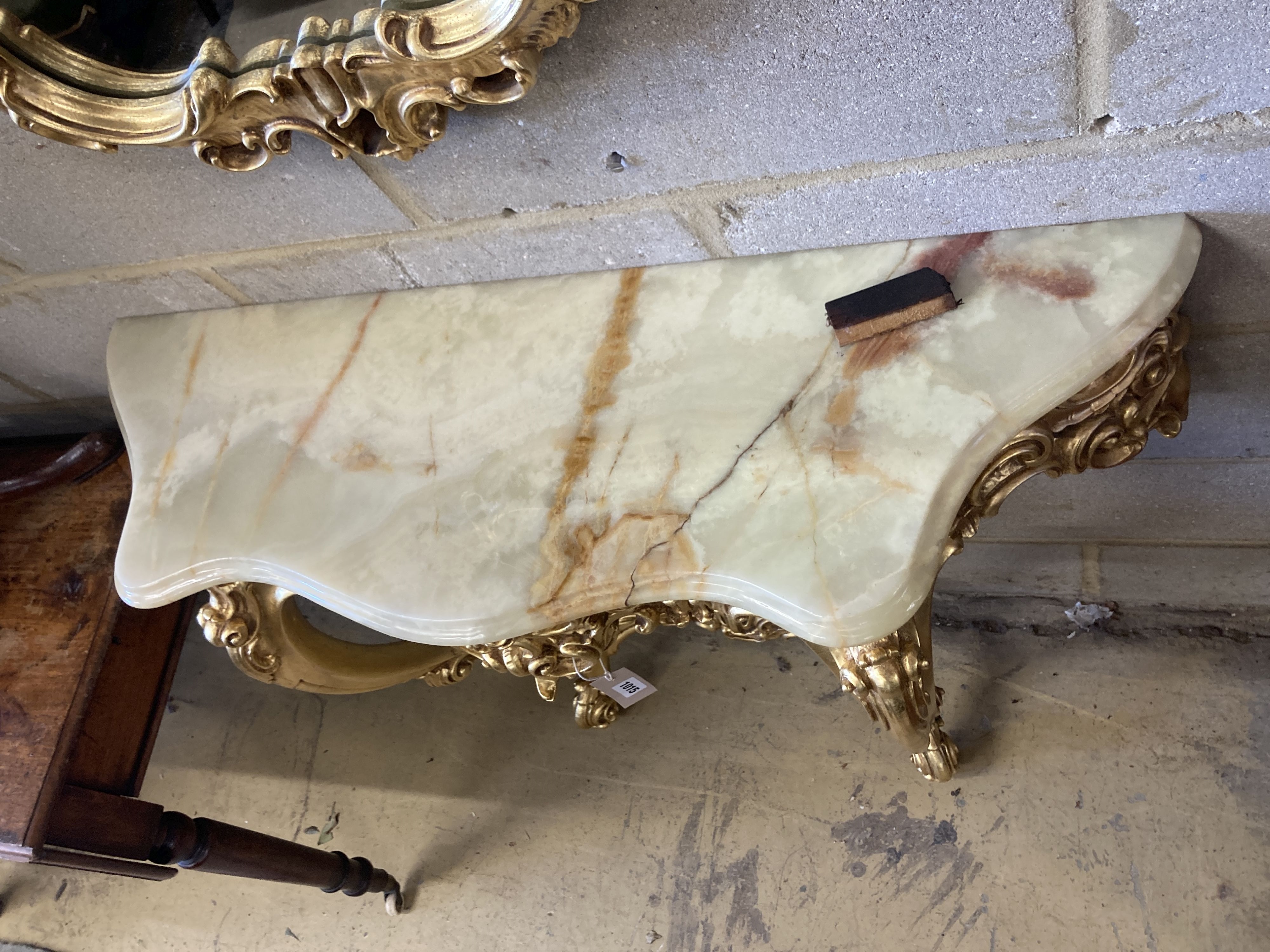 An 18th century style onyx topped gilt console table, width 94cm, depth 29cm, height 87cm with mirror